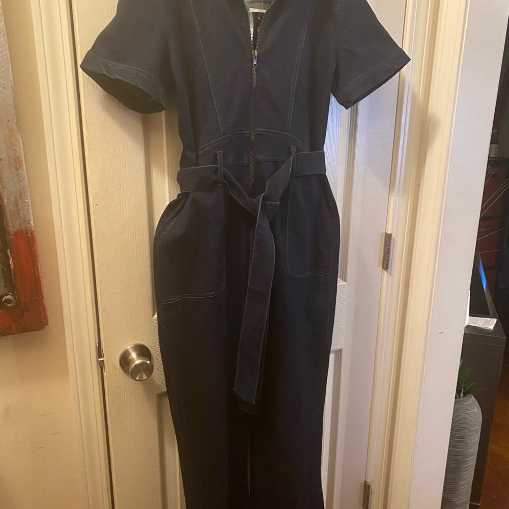 NWT blue denim jumpsuit.   Size women’s large